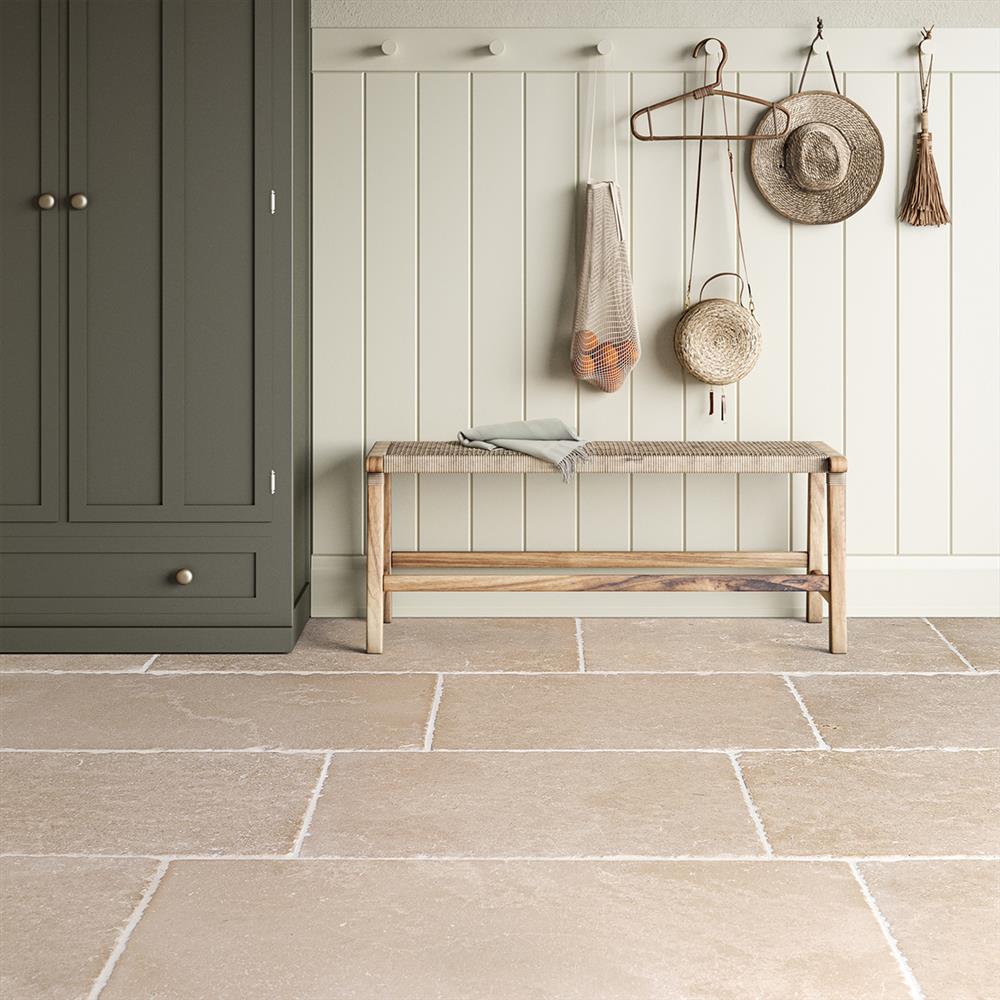 Dijon antiqued limestone slabs in a hallway
